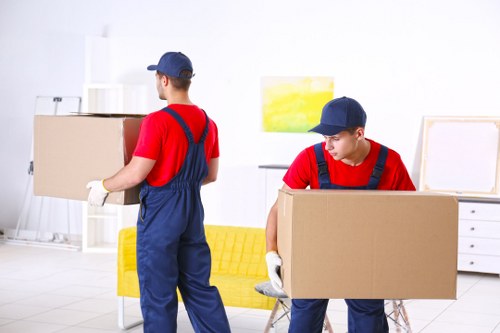 Man with van loading items for a move in Chelsea