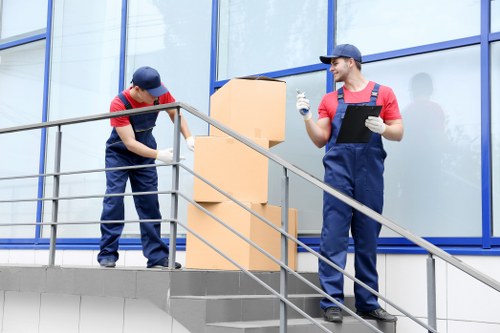 Professional removals crew loading furniture for transport