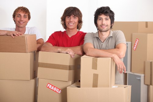 Packed office boxes and equipment ready for a Chelsea business move