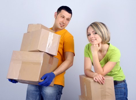 Packers handling fragile household items carefully