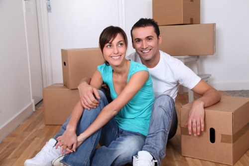 Local Chelsea moving team handling furniture access on a residential street