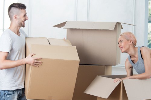 Staff handling furniture carefully during a move