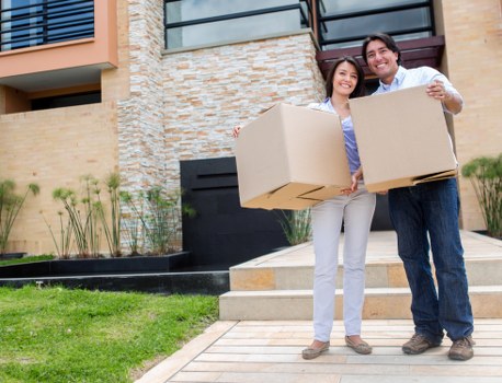 Removalists transporting packed boxes and furniture for a Chelsea family move